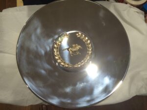 Silver plated plate with case gold horse & jockey motif.
