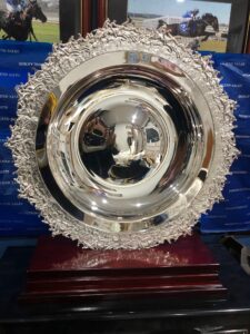 Silver plated plate with horse racing feature around the rim